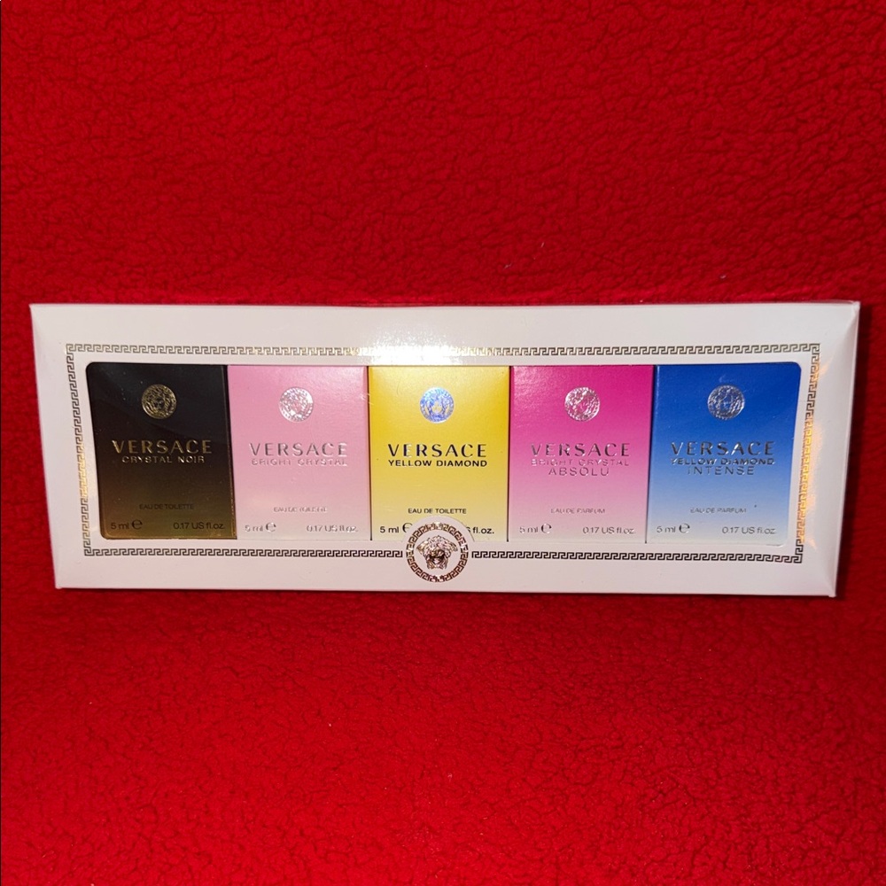 Versace Fragrance Collection with Black, Pink, Yellow, and Blue Bottles